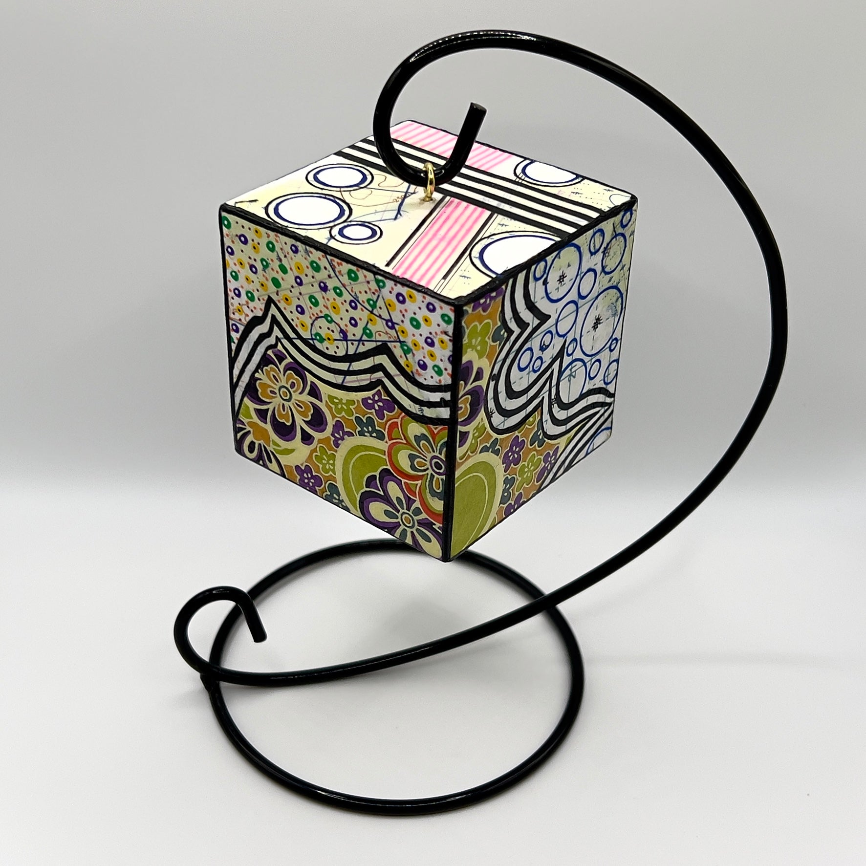 3-D CUBE ART #10 by Mary-Jo Lough, hand-painted 2.25” cube made from solid wood, featuring vibrant abstract art and layered details on a hanging Stand.