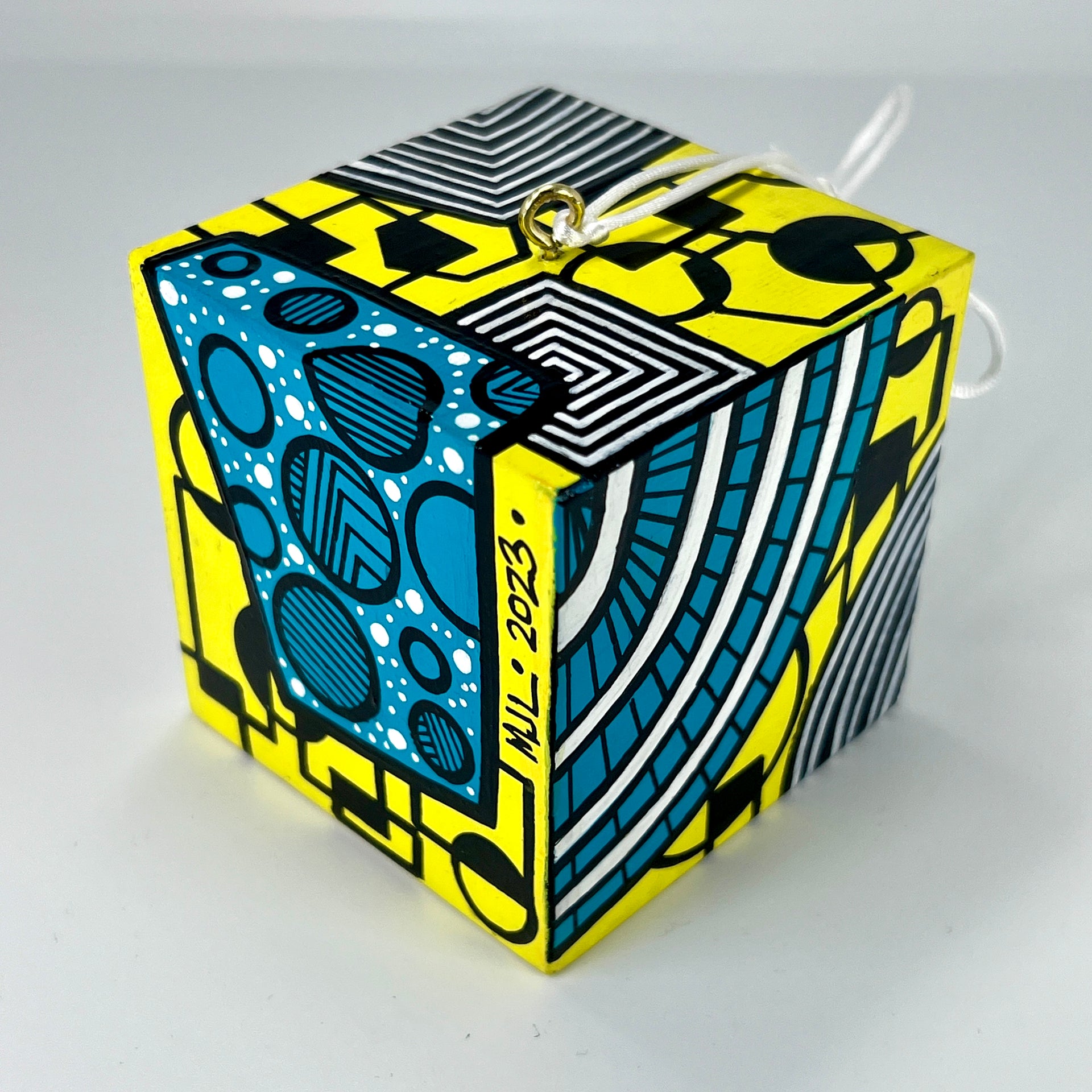 3-D CUBE ART #15 by Mary-Jo Lough, hand-painted 2.25” cube made from solid wood, featuring vibrant abstract art and layered details.