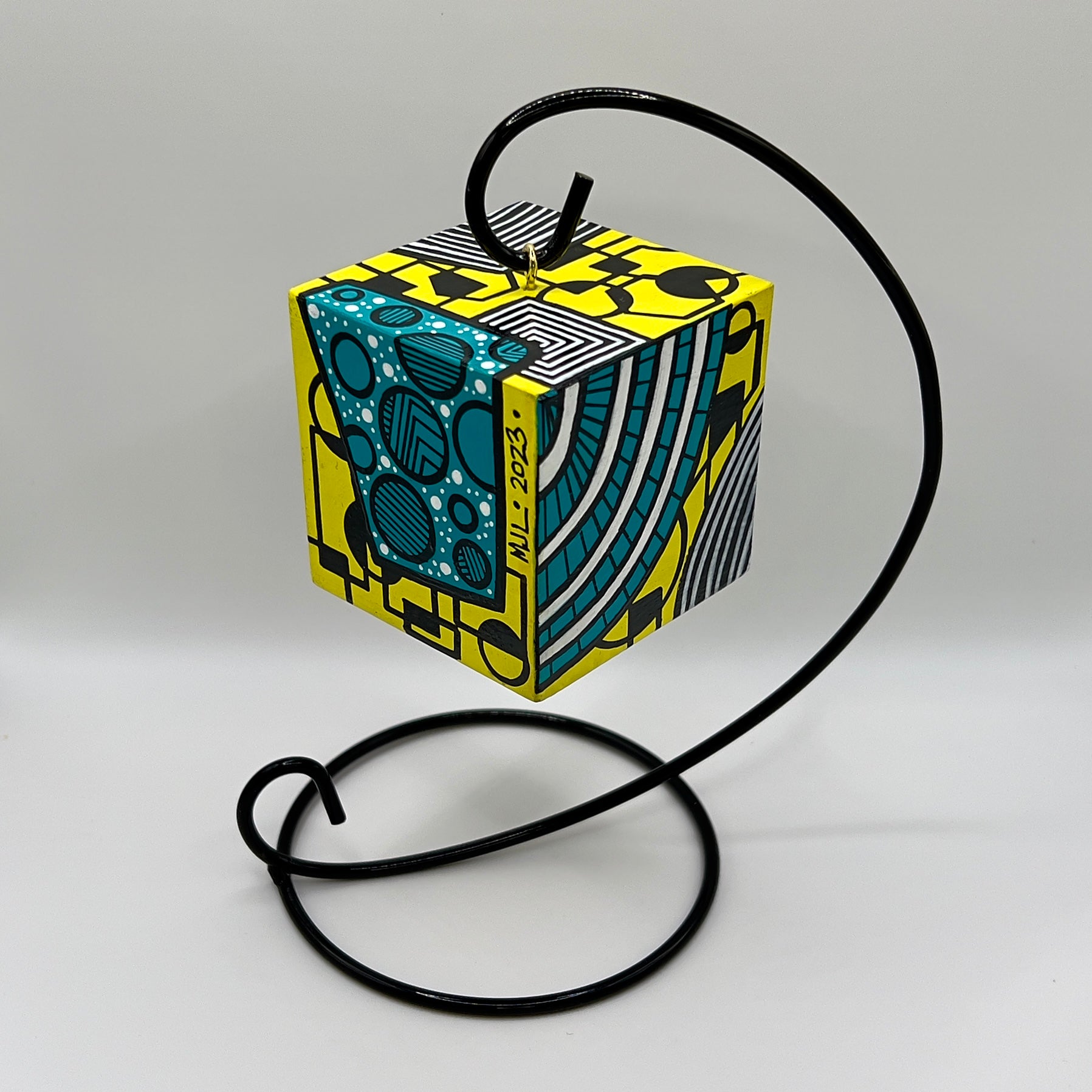 3-D CUBE ART #15 by Mary-Jo Lough, hand-painted 2.25” cube made from solid wood, featuring vibrant abstract art and layered details on a hanging stand