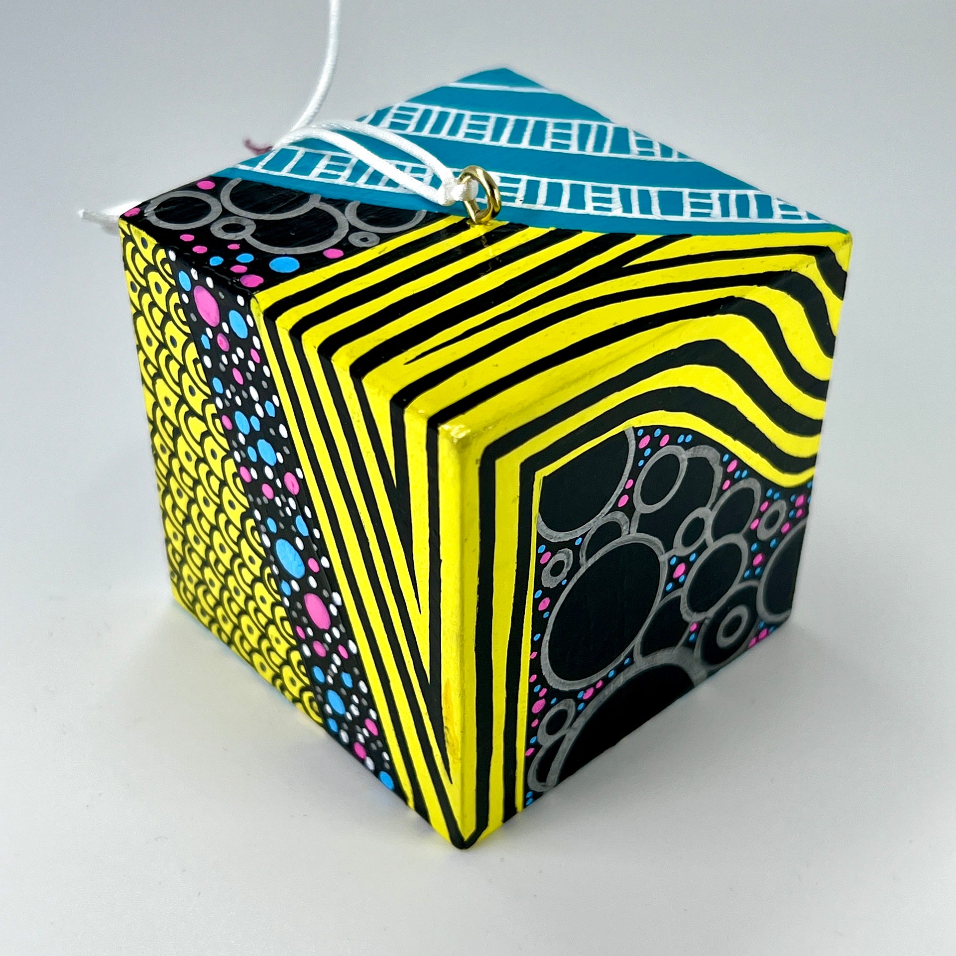 3-D CUBE ART #16 by Mary-Jo Lough, hand-painted 2.25” cube made from solid wood, featuring vibrant abstract art and layered details.