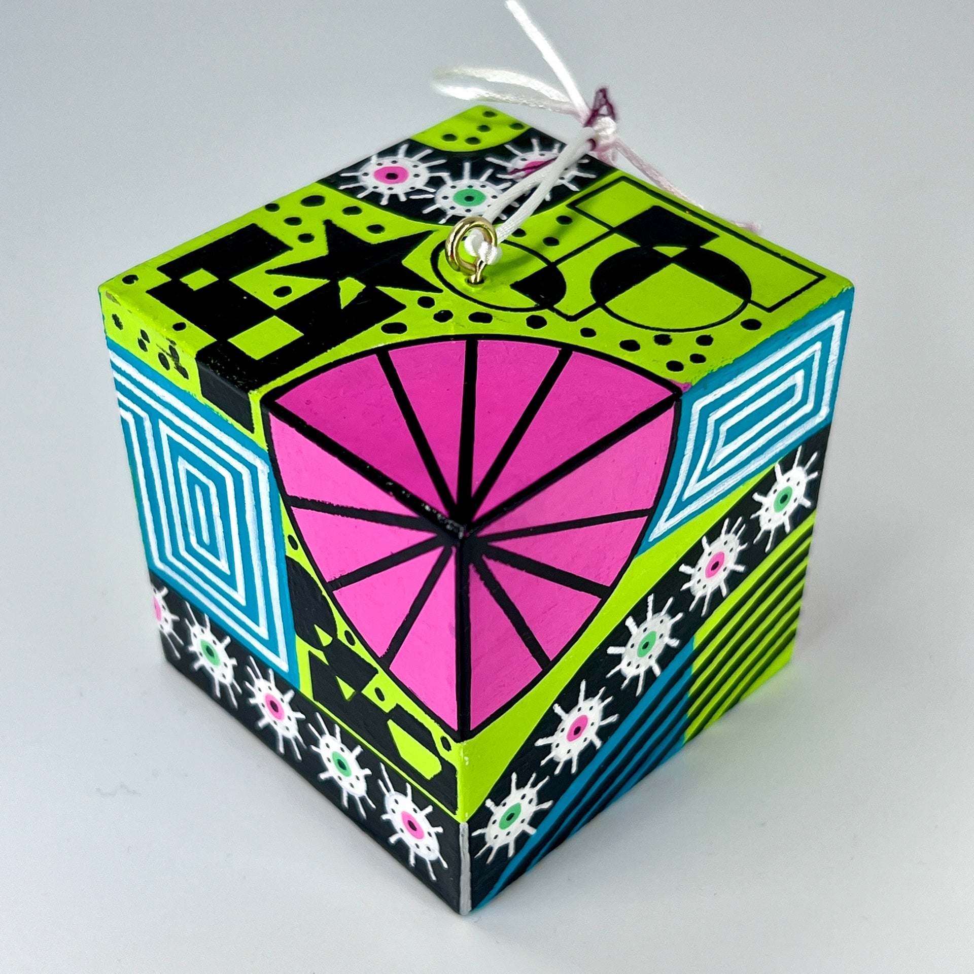 3-D CUBE ART #19 by Mary-Jo Lough, hand-painted 2.25” cube made from solid wood, featuring vibrant abstract art and layered details.