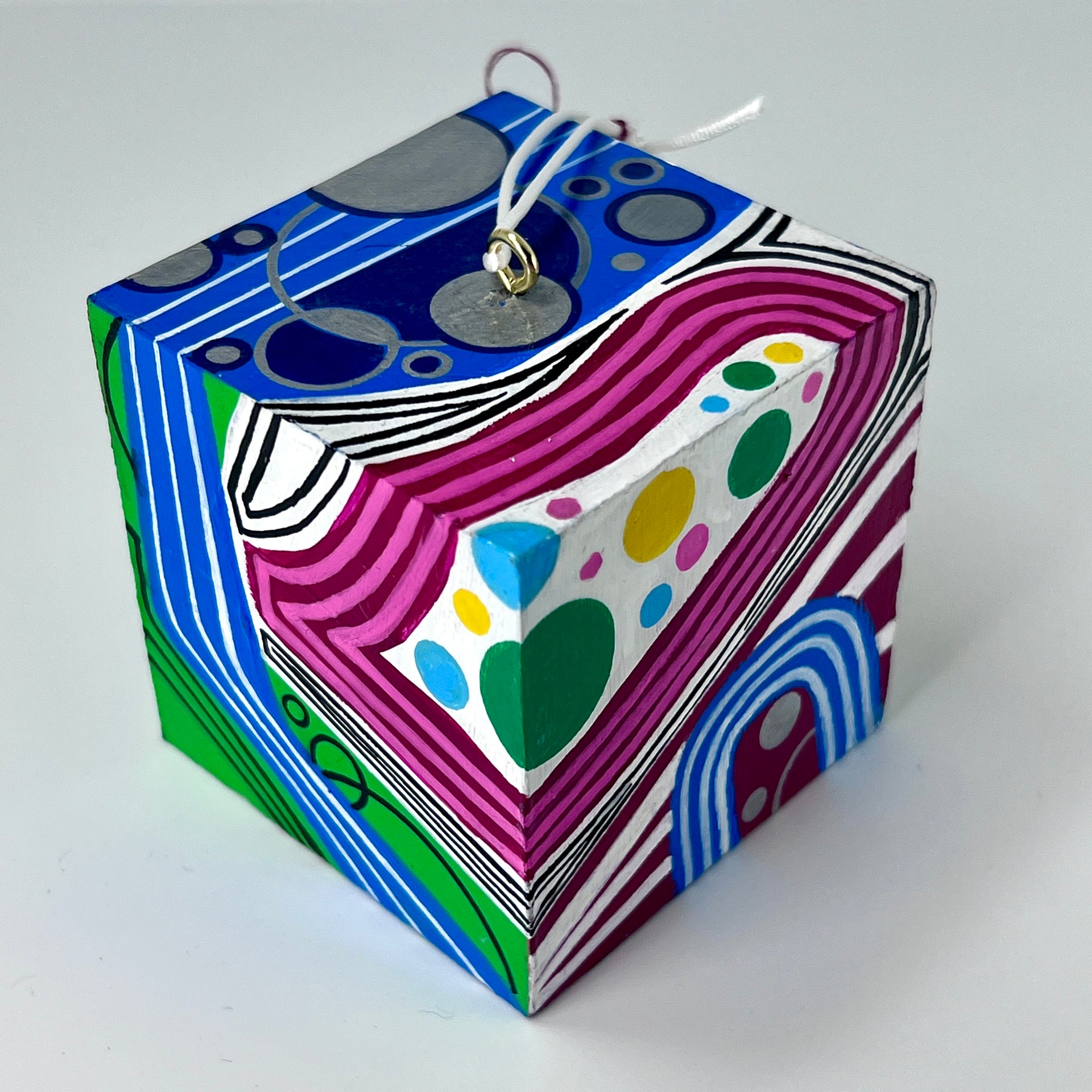 3-D CUBE ART #21 by Mary-Jo Lough, hand-painted 2.25” cube made from solid wood, featuring vibrant abstract art and layered details.