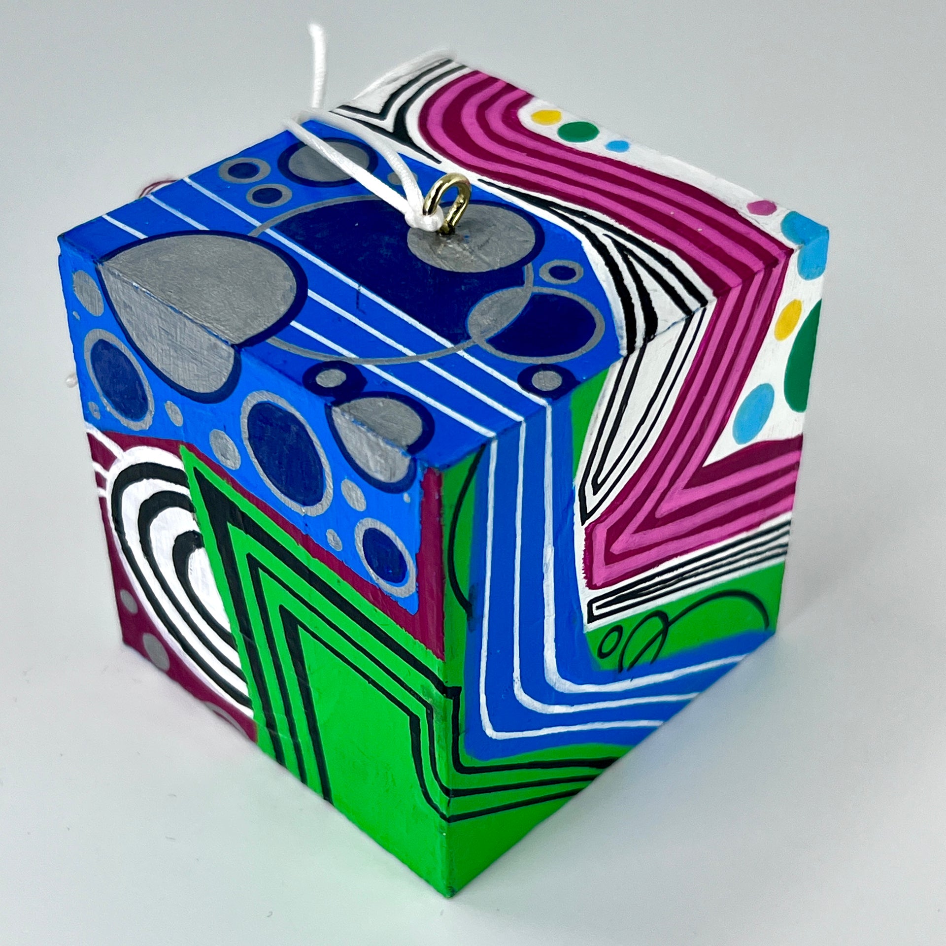 3-D CUBE ART #21 by Mary-Jo Lough, hand-painted 2.25” cube made from solid wood, featuring vibrant abstract art and layered details.