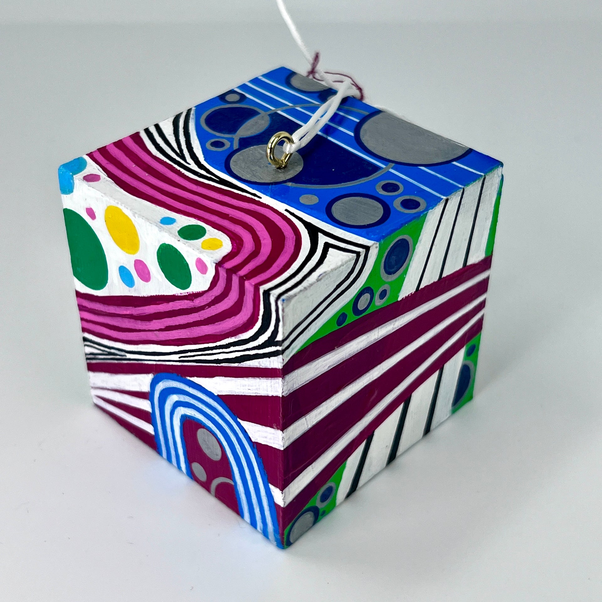 3-D CUBE ART #21 by Mary-Jo Lough, hand-painted 2.25” cube made from solid wood, featuring vibrant abstract art and layered details.