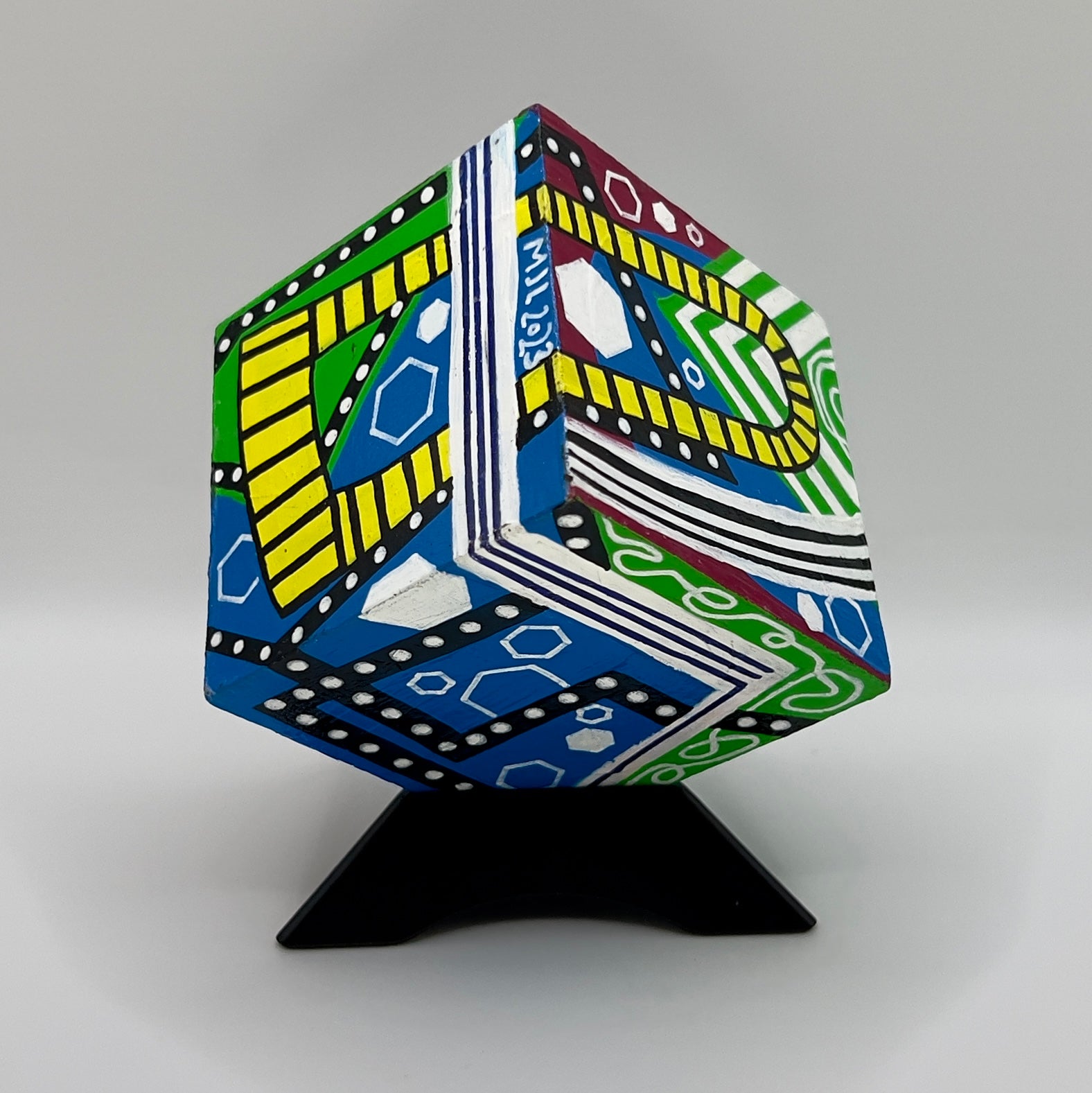 3-D CUBE ART #22 by Mary-Jo Lough, hand-painted 2.25” cube made from solid wood, featuring vibrant abstract art and layered details on a Triangle Stand.