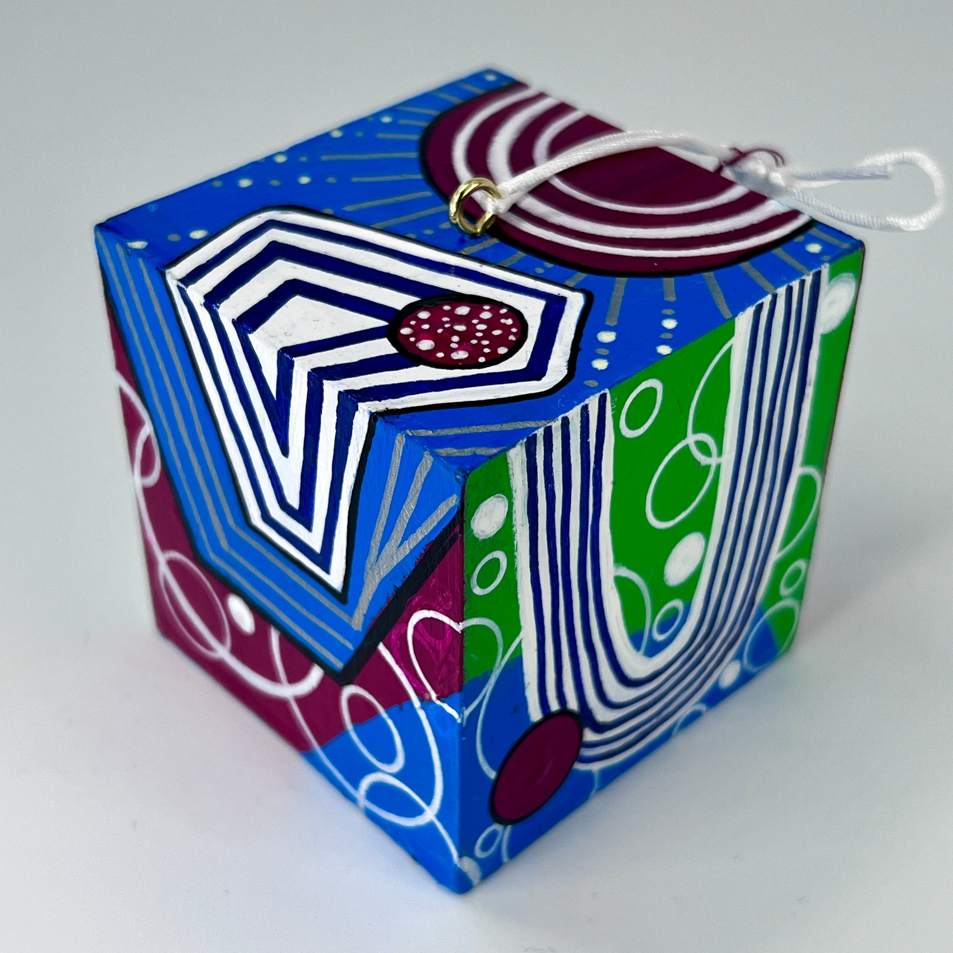 3-D CUBE ART #24 by Mary-Jo Lough, hand-painted 2.25” cube made from solid wood, featuring vibrant abstract art and layered details.