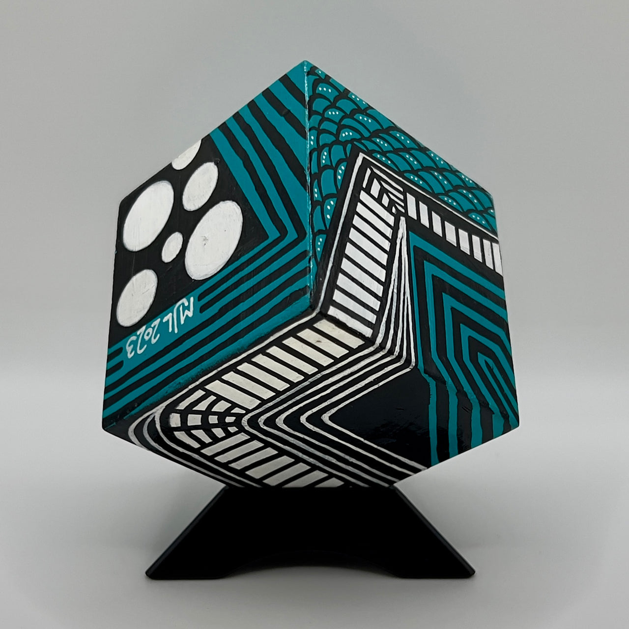 3-D CUBE ART #3 by Mary-Jo Lough, hand-painted 2.25” cube made from solid wood, featuring vibrant abstract art and layered details on a triangle stand.