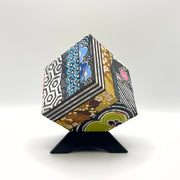 3-D CUBE ART #7 by Mary-Jo Lough, hand-painted 2.25” cube made from solid wood, featuring vibrant abstract art and layered details on a triangle stand.