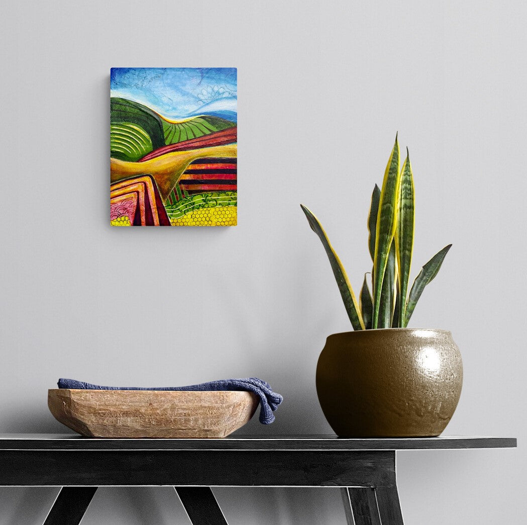 ROLLING PATCHWORK by Mary-Jo Lough, 8" x 10" abstract artwork on a wall in a room depicting undulating hills and flowing skies, inviting reflection on nature.